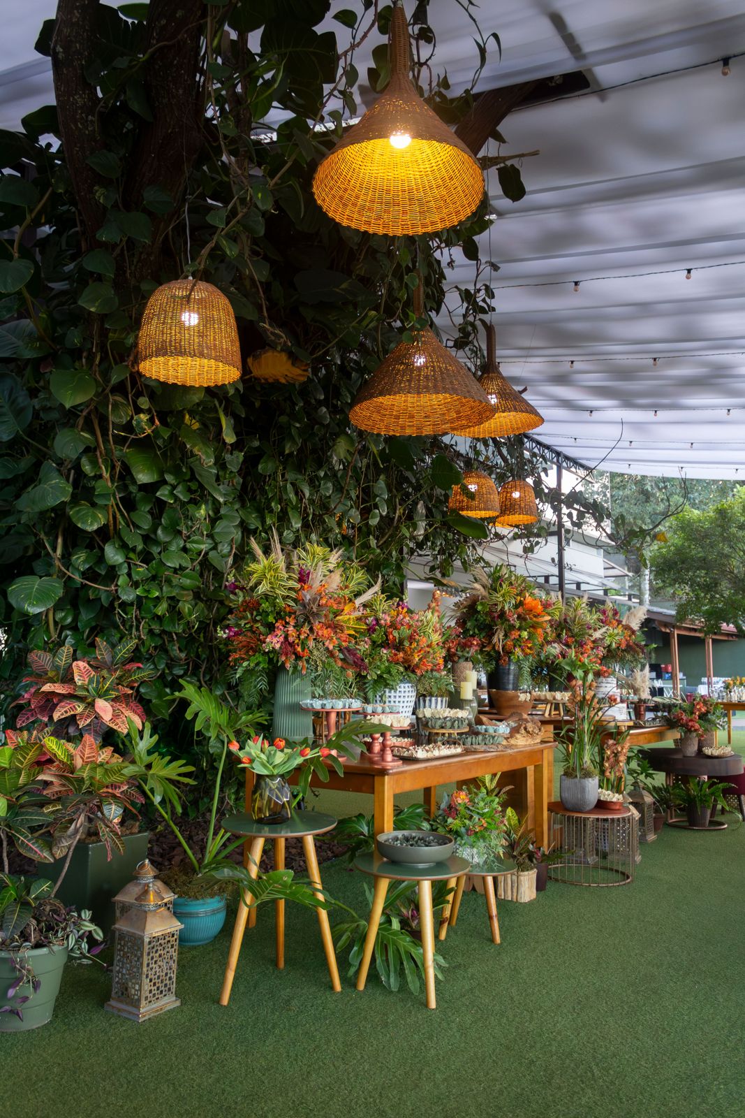 Woven pendant lights above a garden table